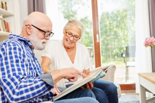 An older couple reading together