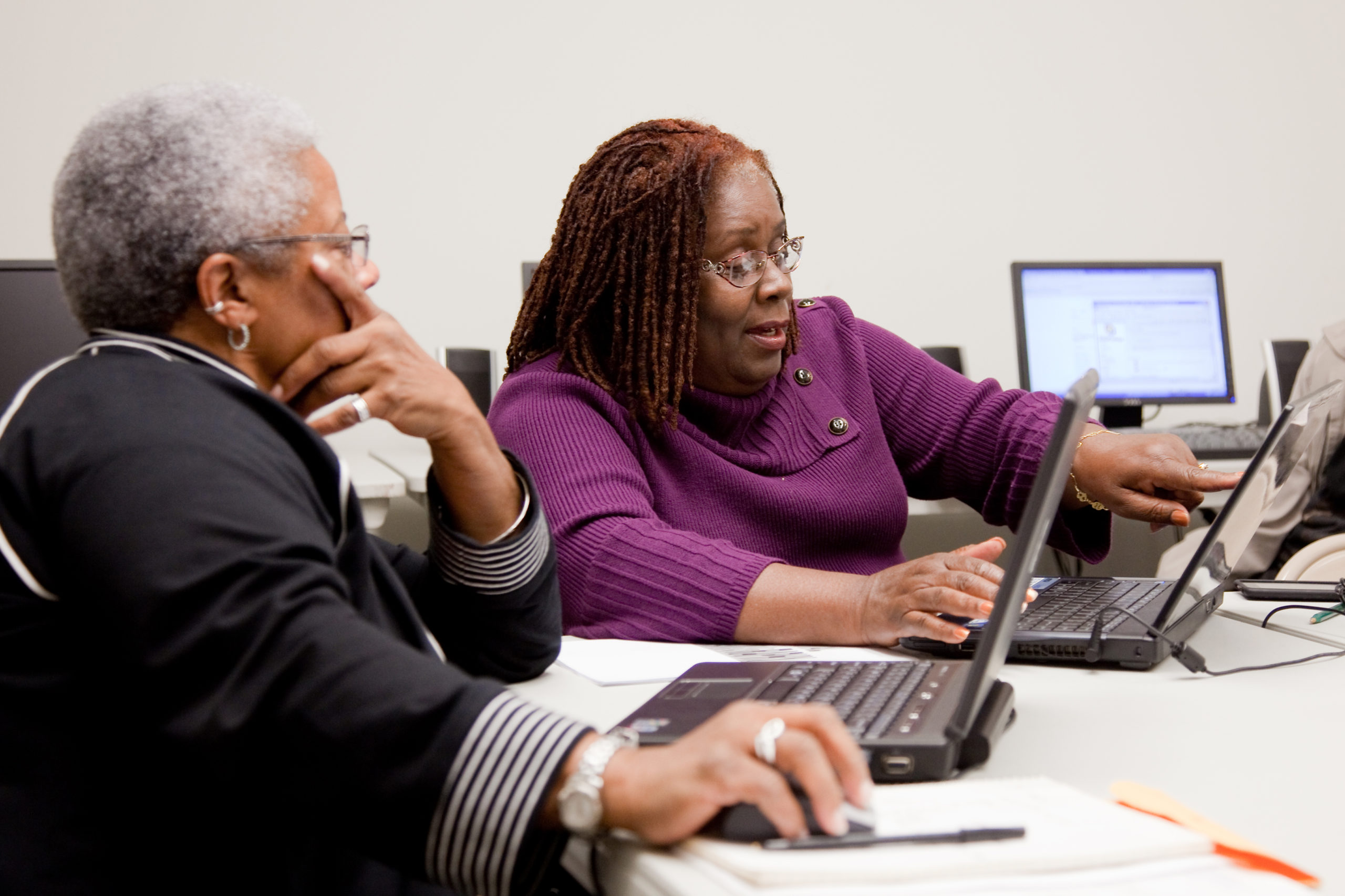 Two women working on a computer