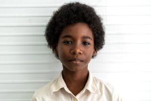 Portrait of black african american cute little boy child sitting
