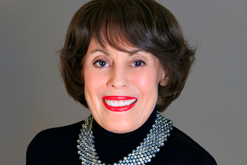 Marylen Mann smiling at camera in black shirt