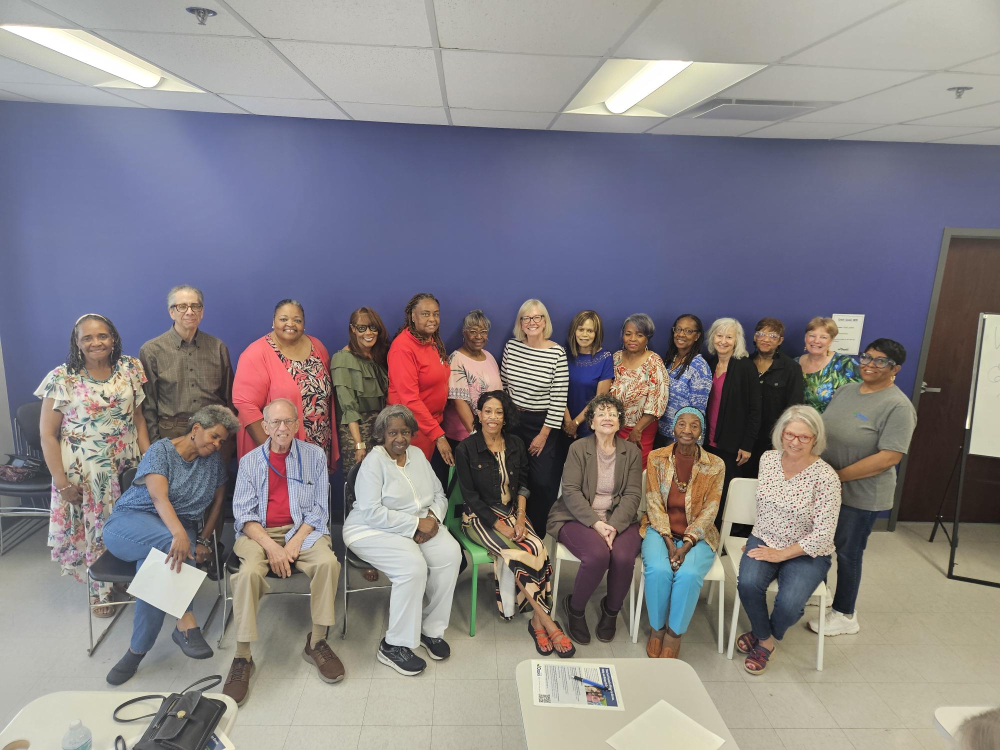 St. Louis Oasis group posing for a photo in a classroom
