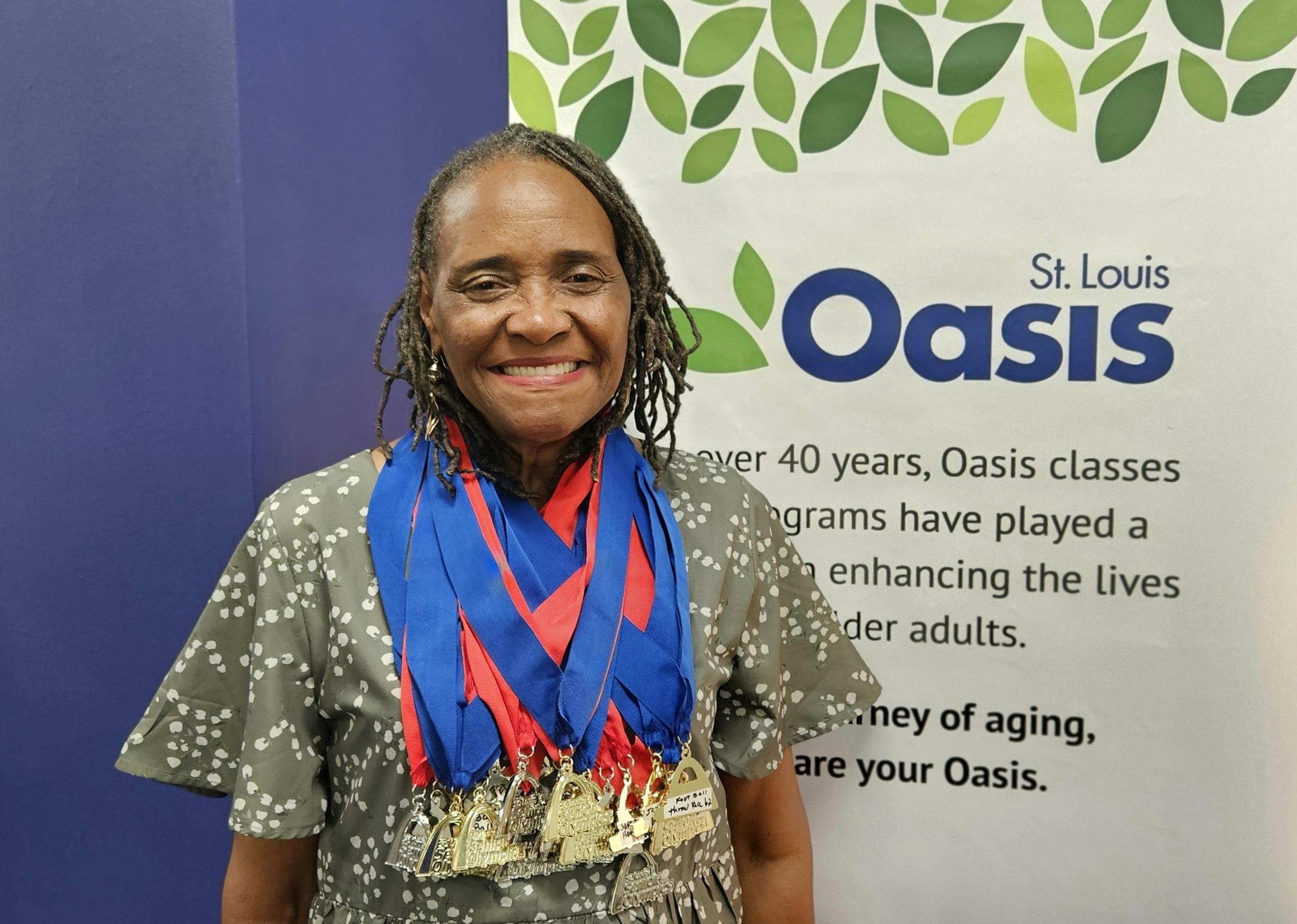 Stella Ashcraft wearing medals at Oasis